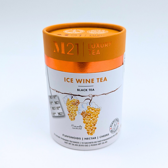 A cylindrical box that holds twelve ice wine flavoured tea bags. The tea bags are pyramid shaped and are blended and packed in Canada. The container is made from 100% recycled paper. The illustration on the canister depicts yellow grapes that are used to make ice wine and matches the yellow coloured lid. It includes instructions to brew for three to five minutes. 