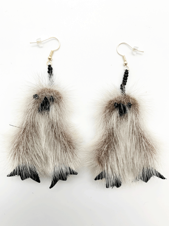 Sealskin owl shaped drop earrings with black beads for eyes.