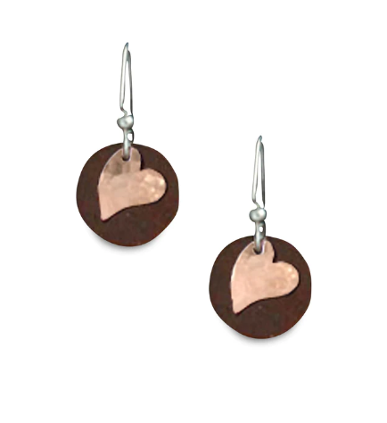 Delicate drop earrings made of tin and copper mounted on hypoallergenic hooks. The earrings are made of two layers: antique upcycled tin cut into circles form the base, and then a hammered copper heart is overlaid to create stunning contrast.