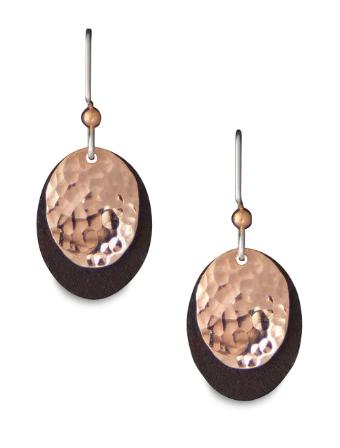 Delicate drop earrings made of tin and copper mounted on hypoallergenic hooks. The earrings are made of two layers: antique upcycled tin cut into ovals form the base, and then a hammered copper circle is overlaid to create stunning contrast.