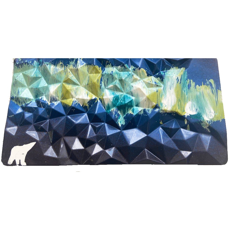 Rectangle chocolate bar with geometric surface. Hand painting of a polar bear and northern light sky. Dark blue sky with light green, yellow, and light blue nothern lights. White polar bear.
