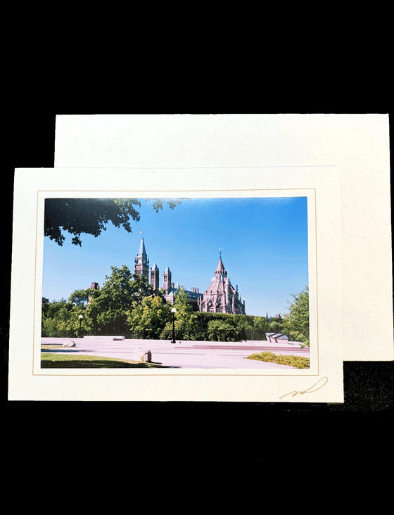 Photography card with a photo of the parliament building and library behind beautiful green trees