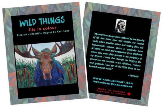 Magnet of Kari Lehr "Bull Rush" art print. Print image is moose in a field of bullrush plants. Magnet is on paper on with a colourful border and has "WILD THINGS" in blue on the front and a message from the artist on the back.