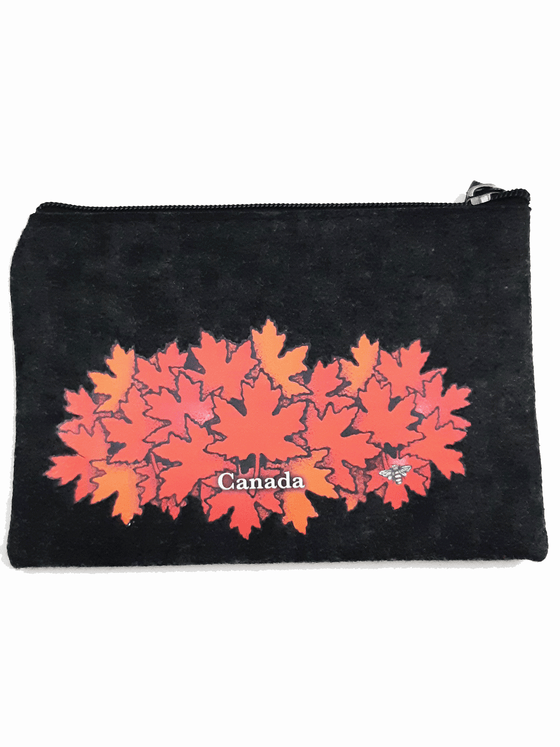 A charcoal felt pouch that features an art print of a spray of red maple leaves. At the bottom right of the picture is the artists mark—a small picture of a bee. The zipper is black with a dark grey zipper puller with a rectangular piece of charcoal felt attached.