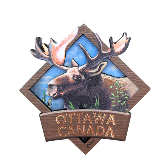 Cool brown bordered diamond shaped wooden magnet. Vibrant Canadian moose centered in a bright sky. The antlers embedded in the boarder above the moose. "Ottawa, Canada" in gold written underneath.