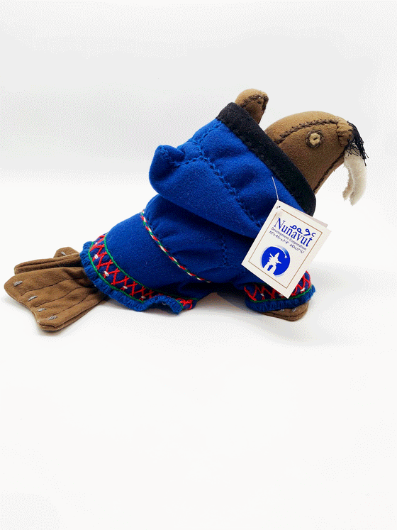 This Walrus Packing Doll was made by Inuk artist Maudie Ohiktook, from Tuluq, Nunavut an depicts a walrus wearing blue traditional Inuit clothing