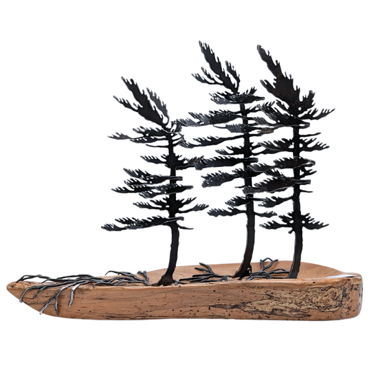 Steel windswept pine trees fitted onto a piece of Canadian polished wood. 