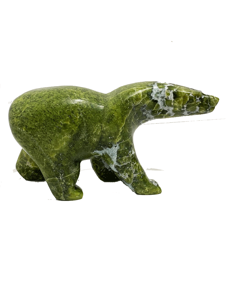 A long-necked bear carved from brilliant green soapstone walks on all fours. The head and forepaws are mottled with white, creating a beautiful contrast with the green. Its head is tilted to one side as though something has caught its attention. This bear faces right.