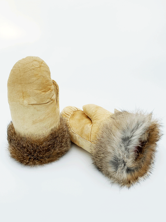Smoked caribou hide Inuit mittens. Brown rabbit fur sewn to the wrists.