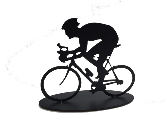 This metal sculpture shows the matte black silhouette a male cyclist hunched forward over their handle bars. He faces left and stares forward intently. The bike design is slightly simplified, and the wheels have no spokes. The piece stands on an oval base.