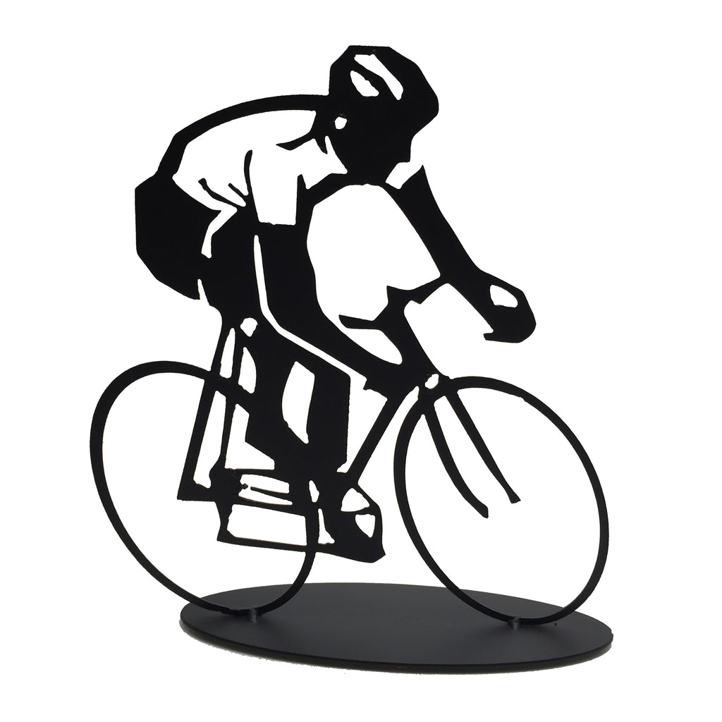 This metal sculpture shows the matte black silhouette of a cyclist riding a bike. The cyclist’s shirt has been cleverly made by punching out the metal, allowing the background to shine through. The piece is carved on a slightly slanted perspective, giving the impression that the cyclist is moving very quickly or beginning a turn. The piece sits on an oval base.