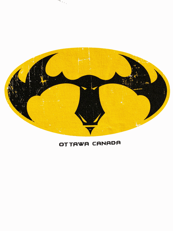 A white shirt. In the middle is a yellow oval with a moose head inside, resembling the batman logo. Underneath is written "Ottawa Canada".