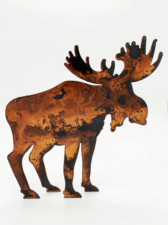 A moose silhouette standing on four legs, cut from warm, weathered steel. The unique dappling of the oxidized steel makes each piece one-of-a-kind.