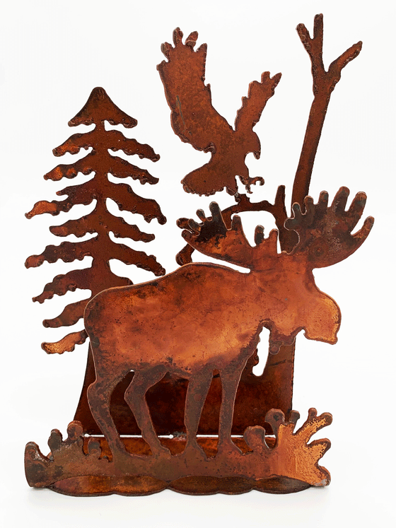 A 3-dimensional tableaux depicting a standing moose, soaring eagle, and bleak pines, cut from warm, weathered steel. The unique dappling of the oxidized steel makes each piece one-of-a-kind.