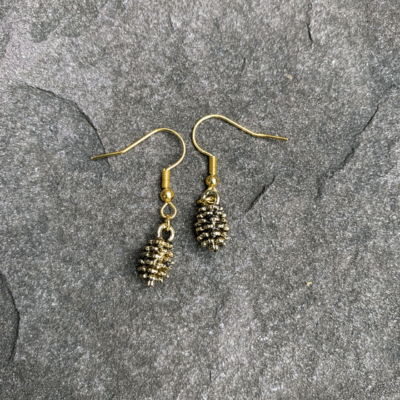 Gold hook earring back. Has shiny gold pinecone attached to earring back with grooves to make it more realistic. Pinecones are dangly.  Two earrings, one pinecone on each earring back. 