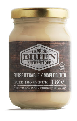 Clear jar with opaque, pale golden maple butter inside.