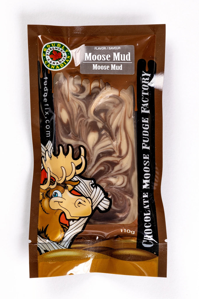 Rectangular Fudge Bar made in Canada Inside of a plastic package. There is a cartoon Moose on the cover of the package, and big writing saying 'Chocolate Moose Fudge Factory'. Flavor of the fudge is labeled Moose Mud. Fudge is light brown maple and chocolate swirled together.