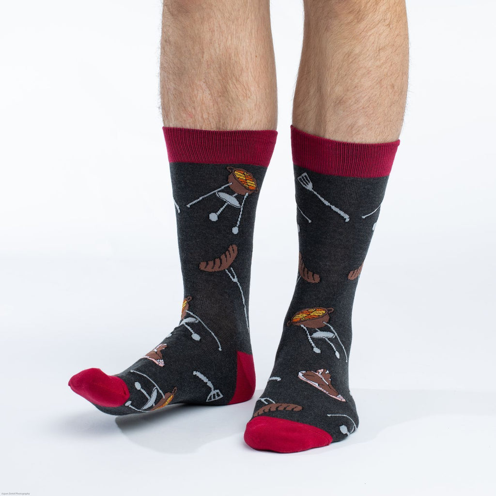 These fun socks feature the images of a charcoal grill, a steak, and a sausage on a fork repeated over the ashy grey background and red toe, heel, and rim. Spandex added to the 85% cotton blend gives the socks the perfect amount of stretch to hug your feet.