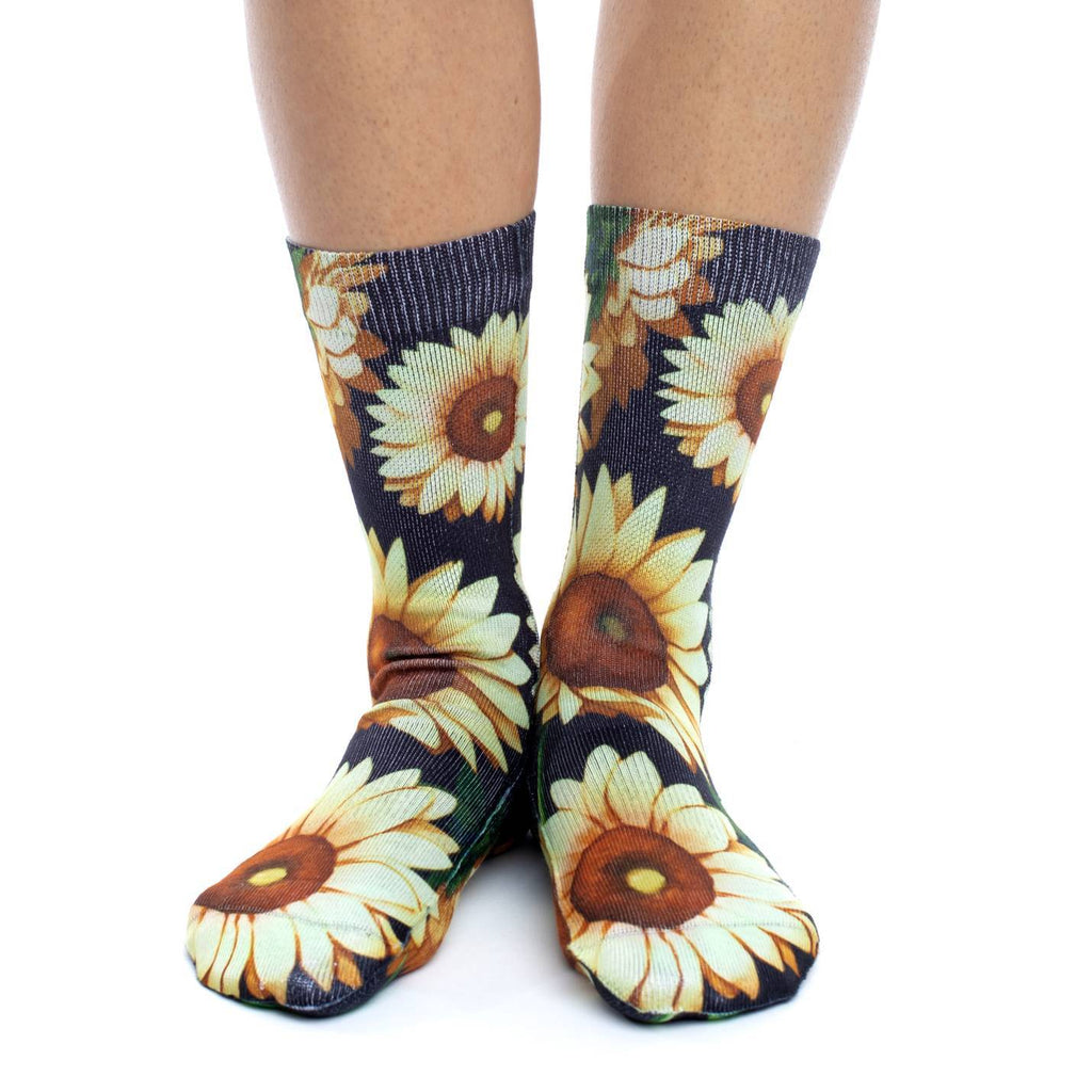 These fun socks feature images of sunflowers on a black background. The active fit socks sport elastic arch bands to contour to your feet and provide support. 