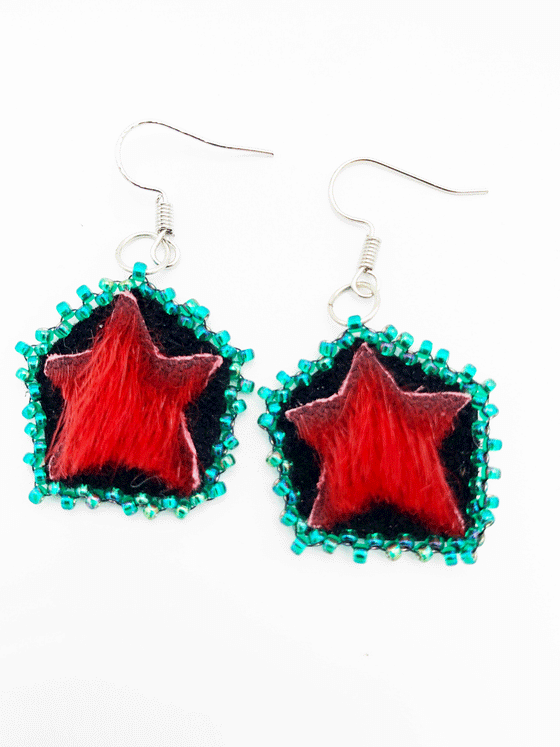 red seal skin, star shaped drop earrings with blue beads around the border.