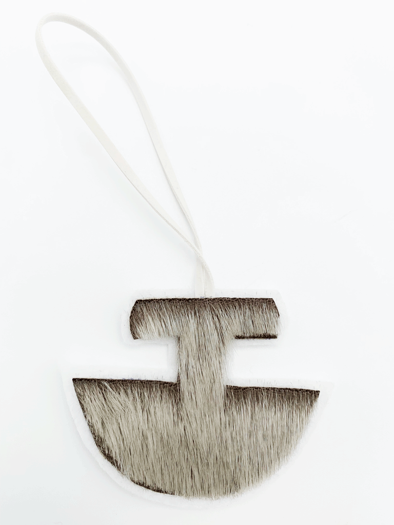 Natural brown grey Inuit ulu ornament with sealskin ribbon.
