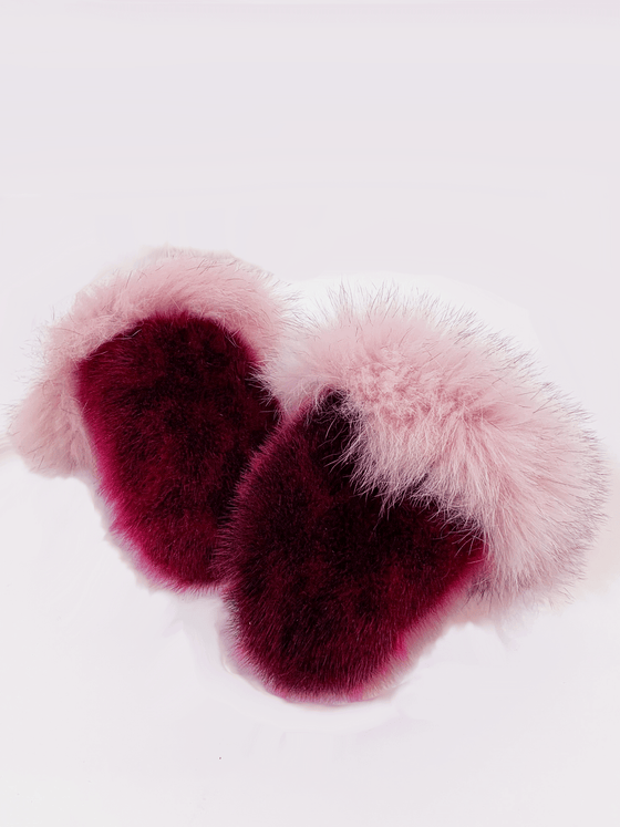 Red dyed fluffy seal skin mittens with pink-white fur cuffs.