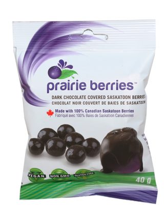 A small white, purple and green package, with images of several of the chocolate covered berries printed below the product's logo.