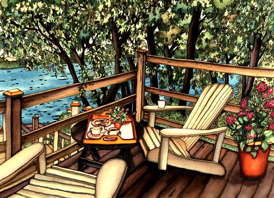 Two lawn chairs on a balcony surrounded by trees and in front of water. There is a flower pot behind one of the chairs and a table with tea and cookies on it.