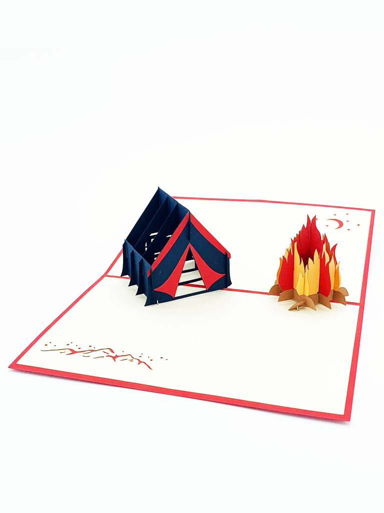 Inside of pop-up card. 3-D Navy blue and red tent beside a 3-D fire pit. Image of mountain and moon flat on the page. Image of moon and mountains are on opposite corners.