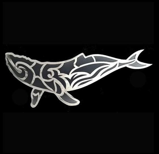 A stylized humpback whale swims in a combination of silhouette and line art. Graceful lines of brushed steel overlaid on top of powder-coated black steel create a durable and layered piece with a powerful sense of dynamism and movement.