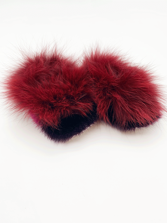 Sealskin slippers. The fur around the foot is a dark purple, and the fur at the top is red.