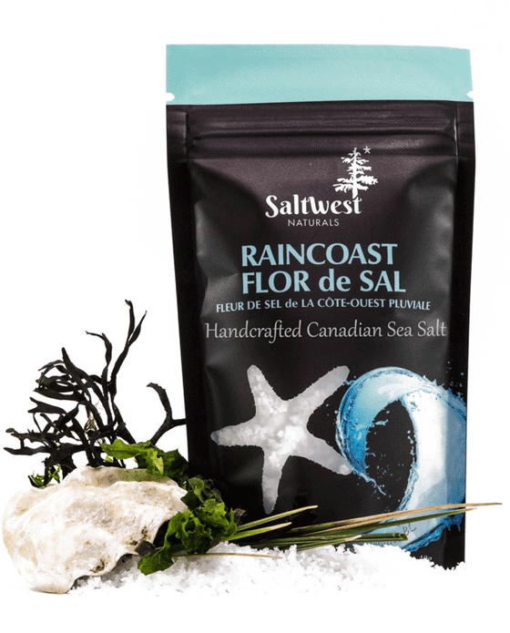 45g of Raincoast Sea Salt. Salt is in a black standing bag, with a picture of a blue wave. There is also a transparent cutout of a starfish.