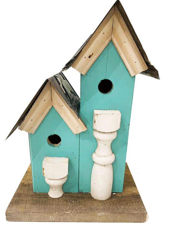 Beautiful handcrafted wooden bird house with a steel roof and vibrantly painted walls.  A double tree house with two doors for the birds!