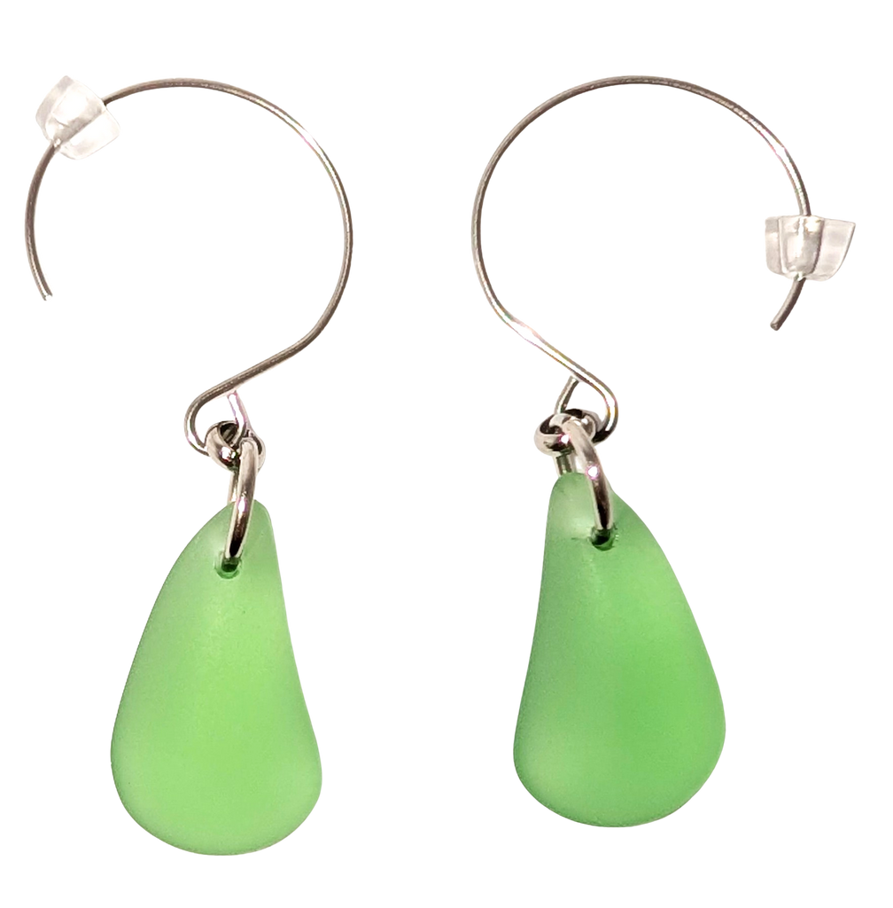 Green teardrop sea glass earrings with silver hooks.