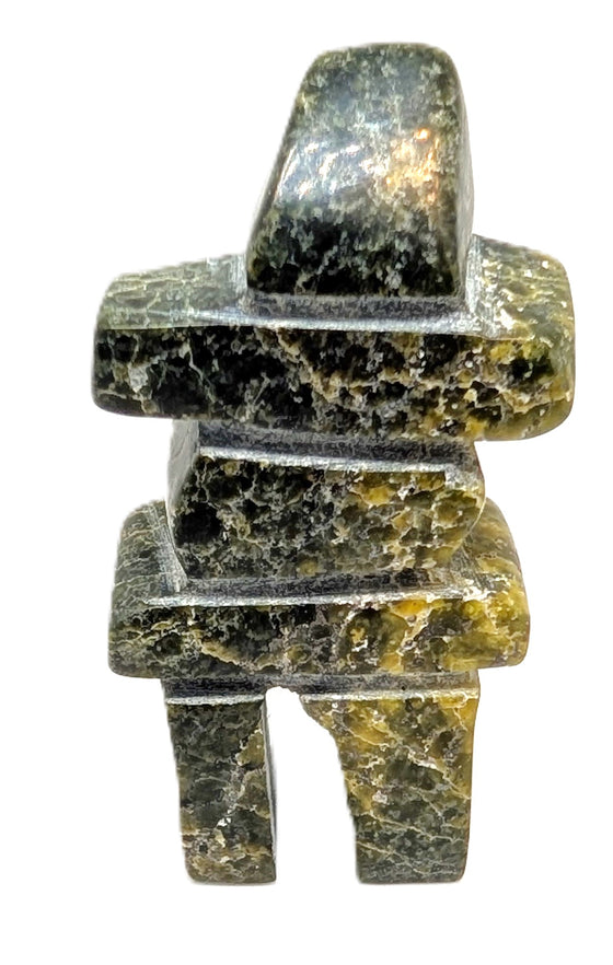 A black and green marbled inukshuk soapstone carving.