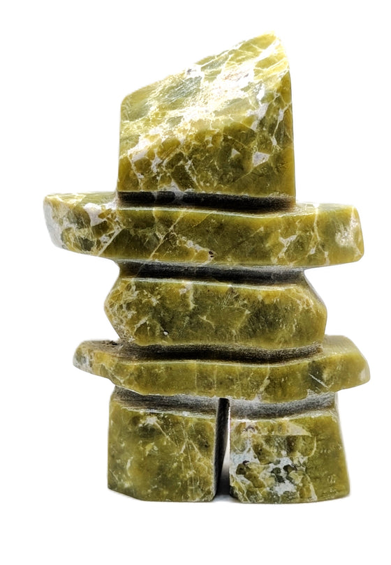 A rectangular green marbled inukshuk soapstone carving.