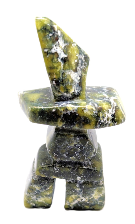 A green, white and black marbled inukshuk soapstone carving.