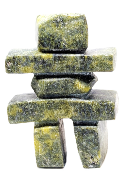 A green marbled inukshuk soapstone carving.
