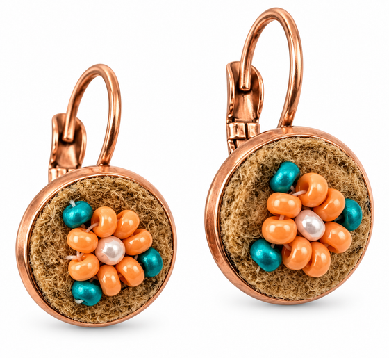 A pair of bronze leverback earrings with round brown moose hide facepalm charms featuring blue and orange beaded flower details, shown on a white background.