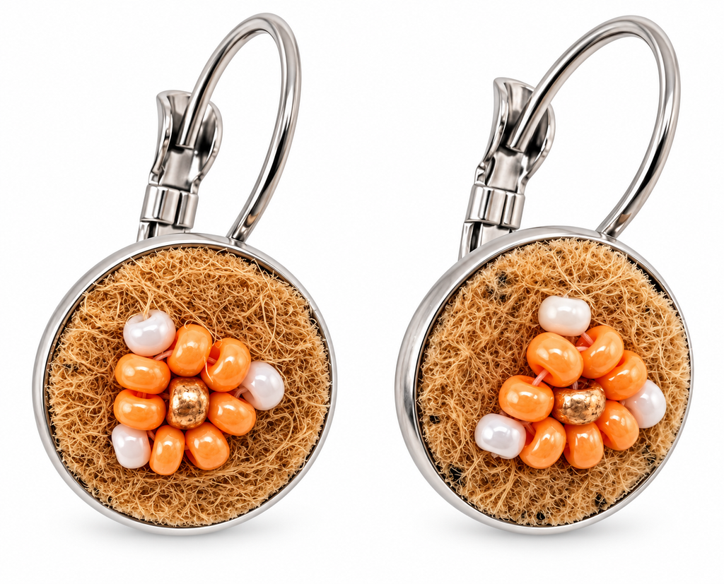 A pair of silver leverback earrings with round brown moose hide facepalm charms featuring orange and bronze beaded flower details, shown on a white background.