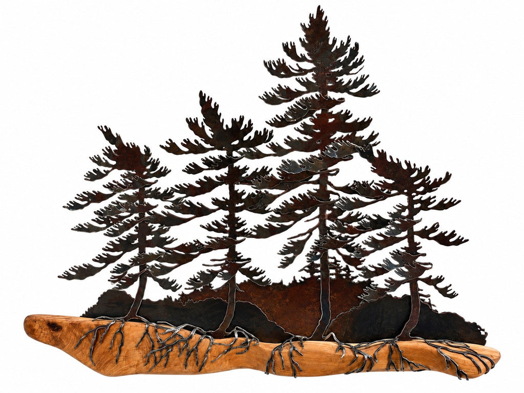 Metal wall art sculpture depicting four pine trees with detailed branches and leaves, mounted on a natural wood driftwood base with wire wrapping, shown against a plain white background.