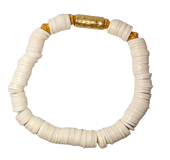 Bracelet with white disc beads and gold accent beads.