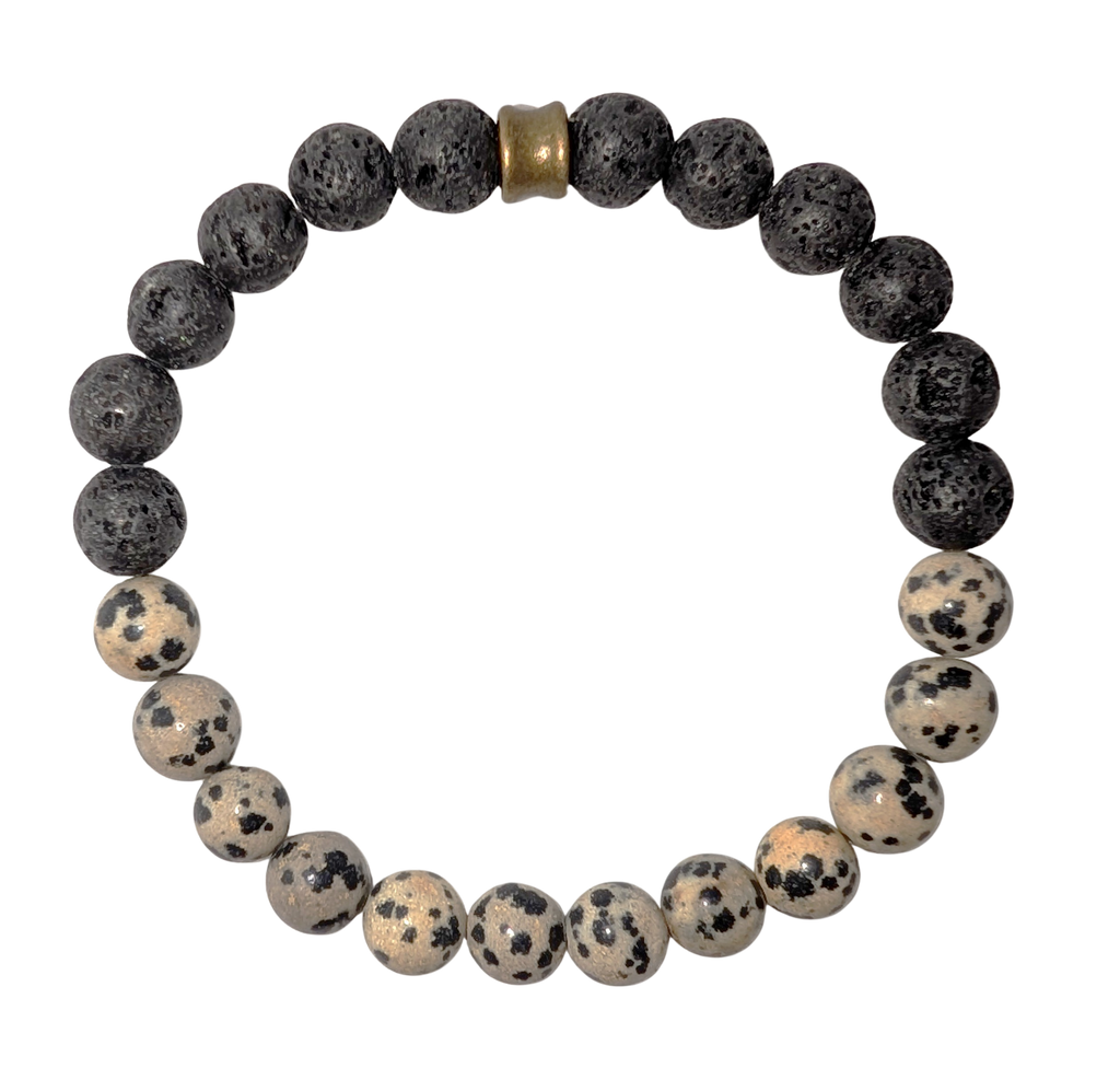 Bracelet with one half of spotted light beige and black dalmatian jasper beads and the other with black lava beads.