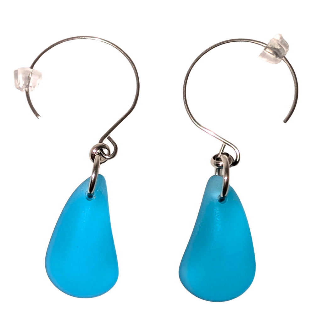Turquoise teardrop sea glass earrings with silver hooks.