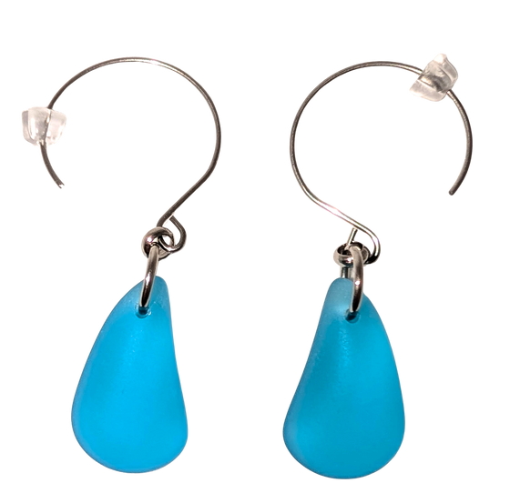 Turquoise teardrop sea glass earrings with silver hooks.