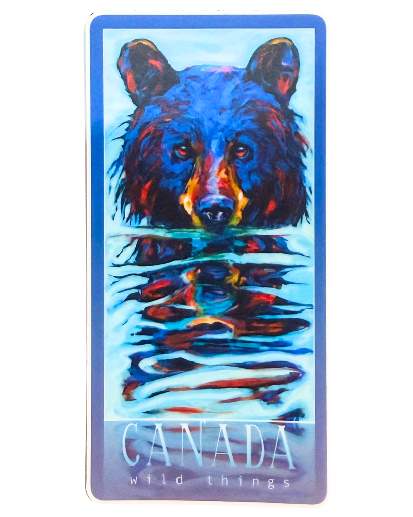 Colorful bear peeking its head out of water sticker with 'Canada Wild Things' text with a blue border.