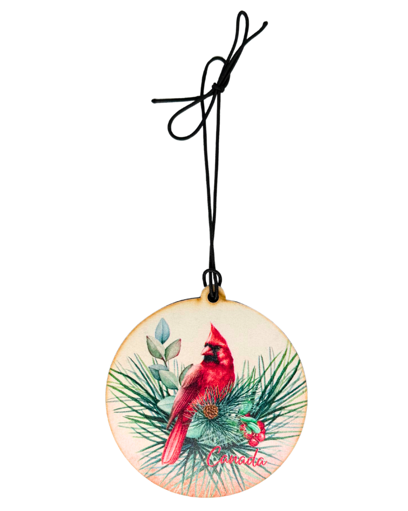 Decorative ornament with a red cardinal in a leafy nest.