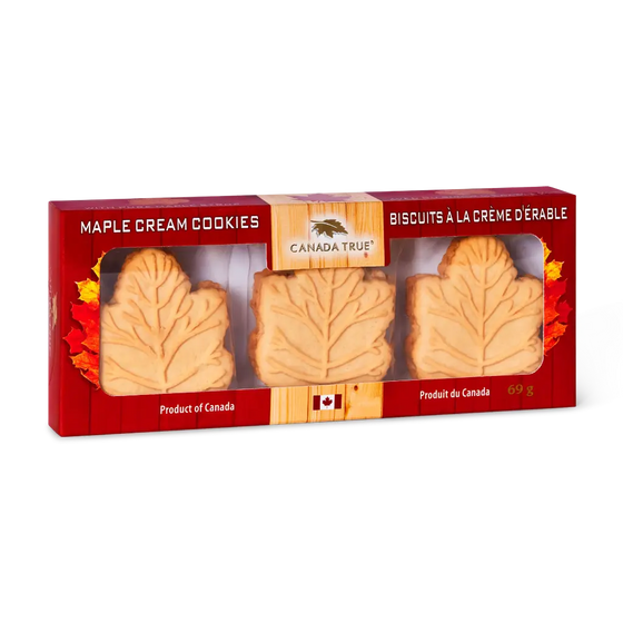 A 69g box of Canada True Maple Cream Cookies, featuring three leaf-shaped cookies visible through a clear window in a red cardboard packaging with autumn leaf designs.