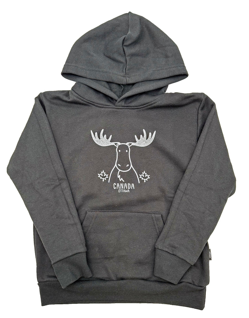 A black kids hoodie with a pocket in the front and a hood. In the middle is a white moose outline with white filled in antlers. There are two small maple leaves on each side of the moose. Underneath the moose is written Canada, and underneath Canada is written Ottawa, both in all caps.