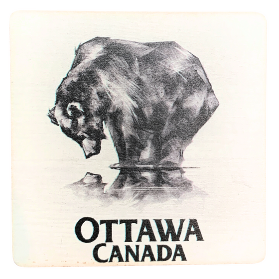 A square wooden magnet with rounded corners featuring a black bear staring down at its reflection against a white background. The words "Ottawa, Canada" are written in black beneath the bear.